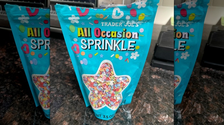 A bag of Trader Joe's All Occasion Sprinkle sits on a stone countertop