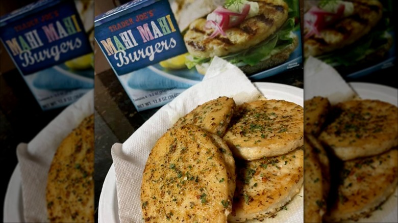 A box of Trader Joe's Mahi Mahi Burgers sits on a red towel.