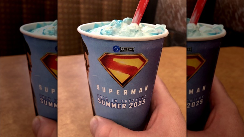 hand holding Dairy Queen Superman Blizzard