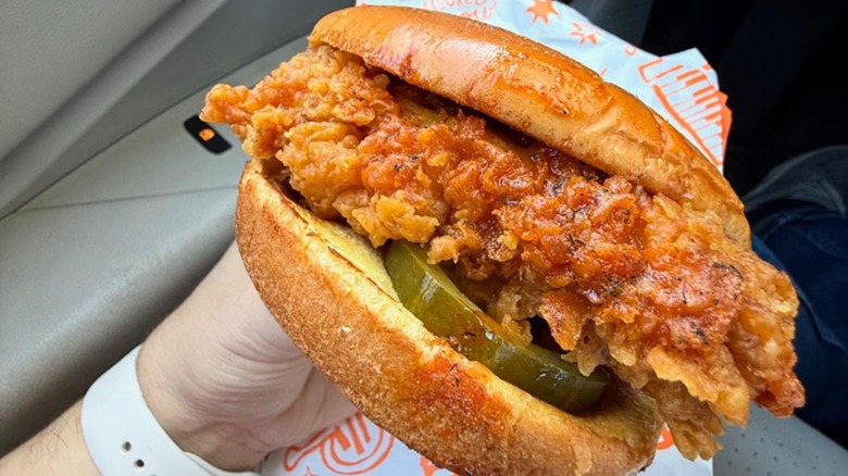 close up of Popeyes Pickle Glaze sandwich