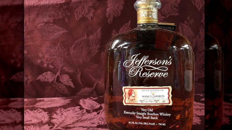 Bourbon bottle on red backdrop