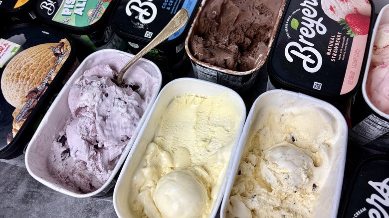 Several open and closed containers of Breyers ice creams, including flavors like cookies and cream, cherry vanilla, and French vanilla