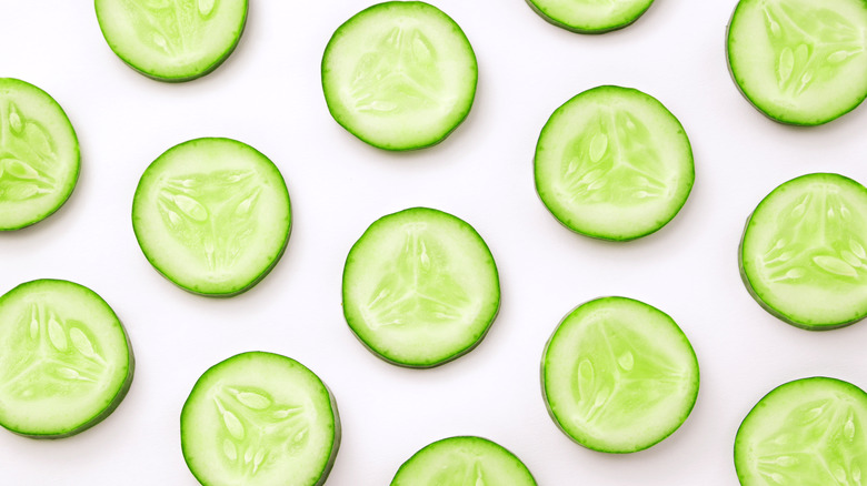 Cucumber slices on white background