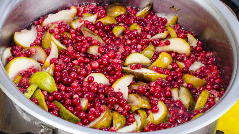 Pears and cranberries in pot
