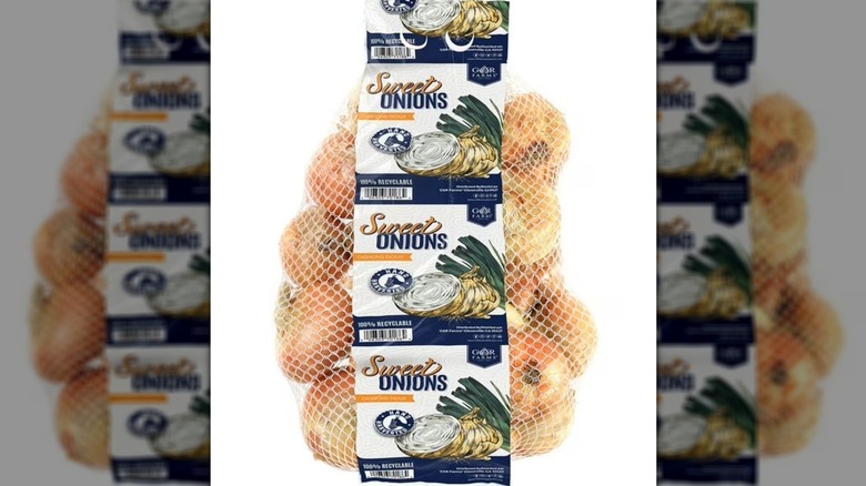Mesh bag with paper label containing sweet onions.