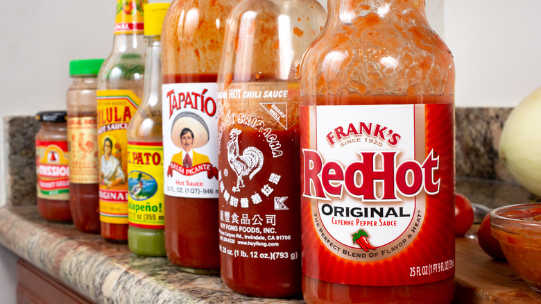 hot sauce bottles on a shelf