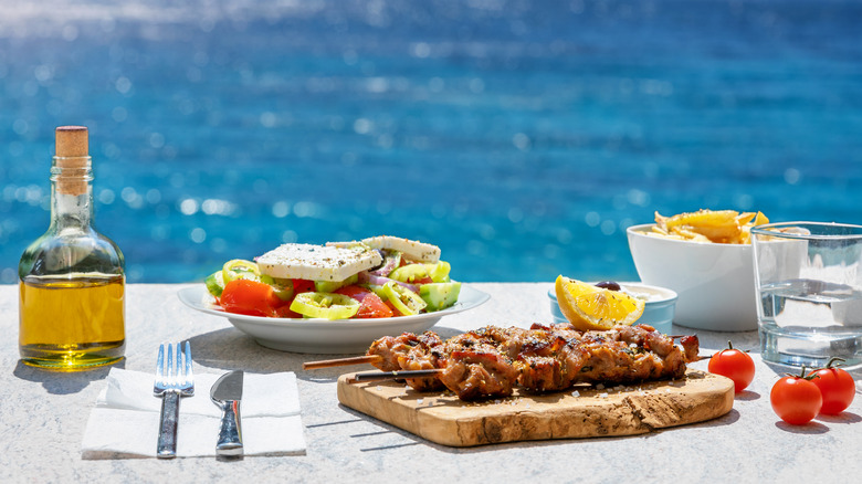 Traditional Greek meal ocean background 