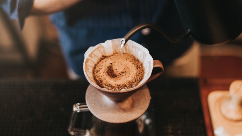 Person making pour-over coffee