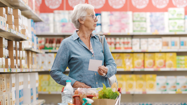 woman shopping with grocery list