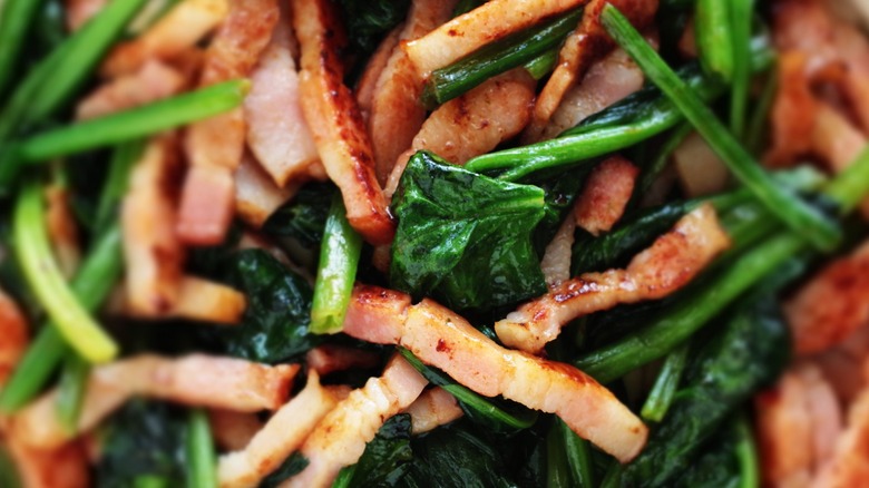 Wilted spinach and cooked bacon bits