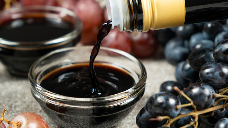 balsamic vinegar pouring into bowl