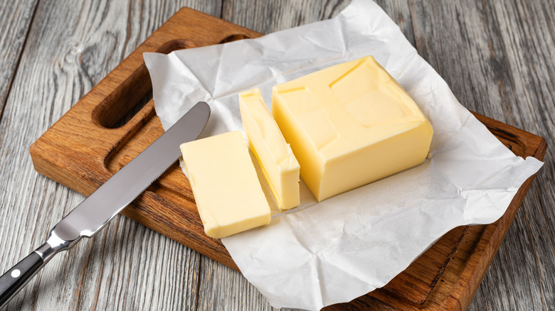 butter on wooden cutting board