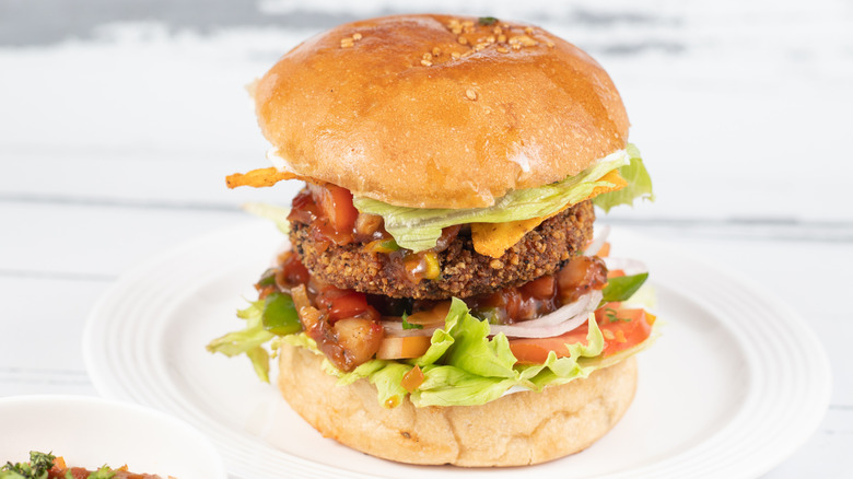 aloo tiki burger stacked with fixings