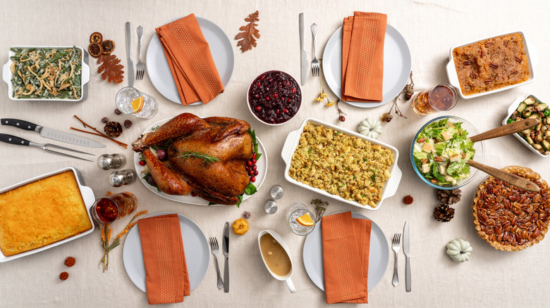 A turkey roast with green bean casserole and other side dishes