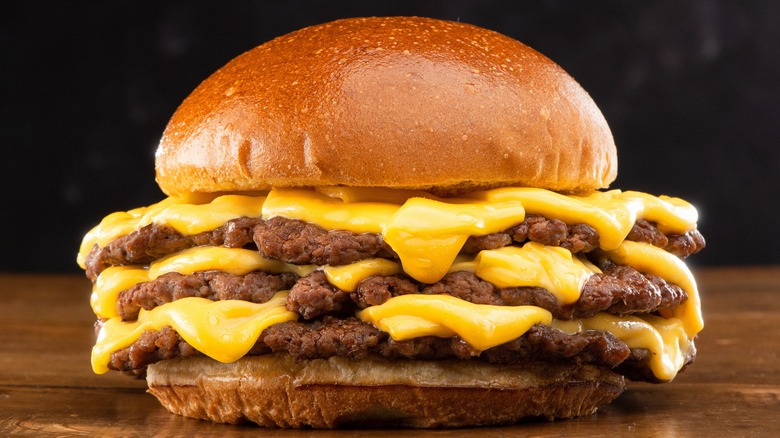 Triple smash burger with cheese in a bun