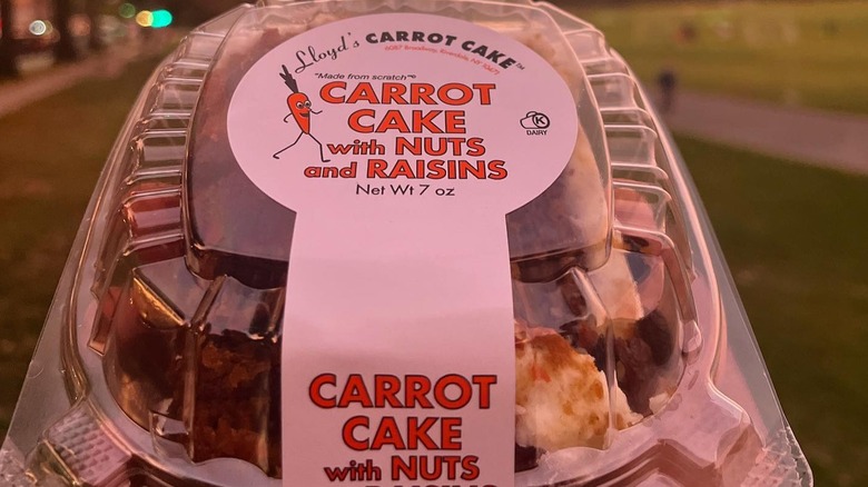 Plastic box from Lloyd's Carrot Cake with sunset in background