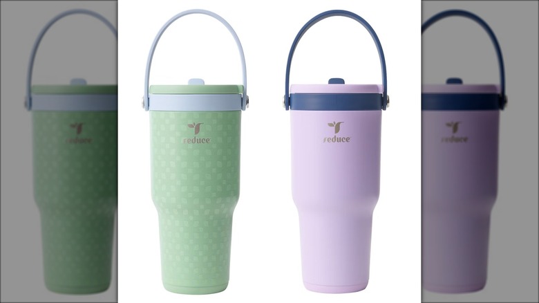 Two portable drinking tumblers with handles and lids.