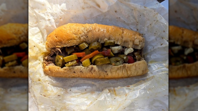 Italian beef sandwich with peppers on a roll from Johnnie's Beef