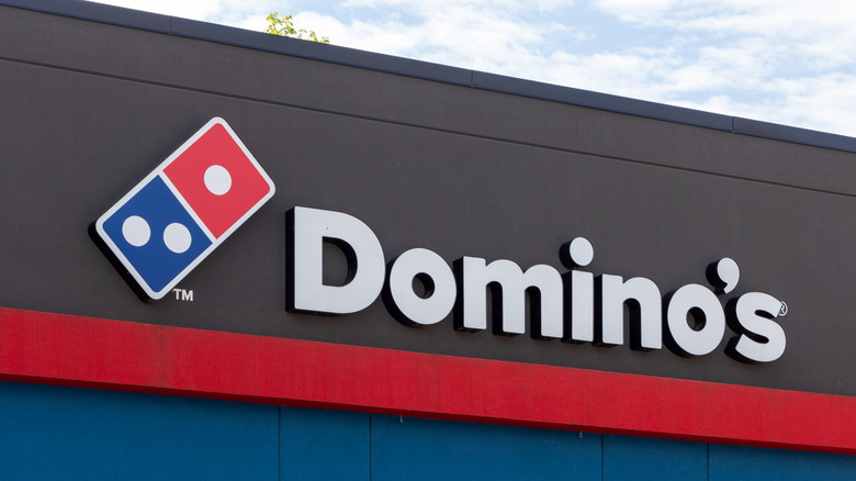 Domino's sign with logo symbol