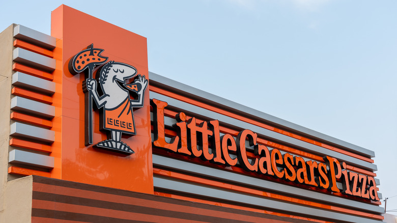 Orange Little Caesars Pizza sign with logo