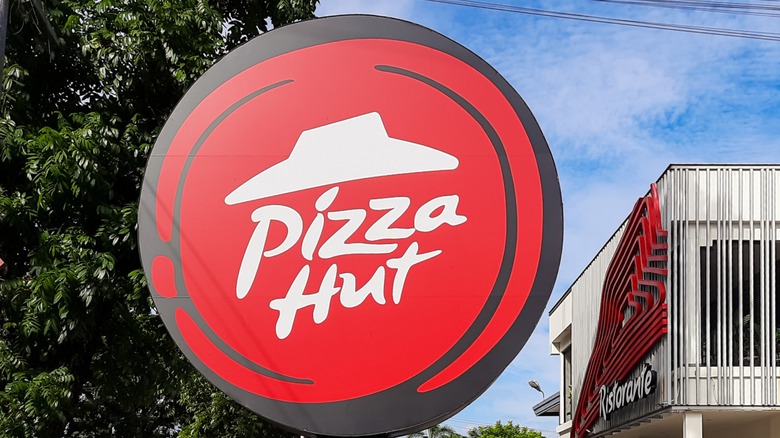 Red and white Pizza Hut sign