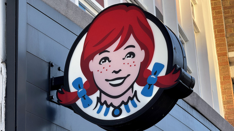 Wendys logo with mom in collar