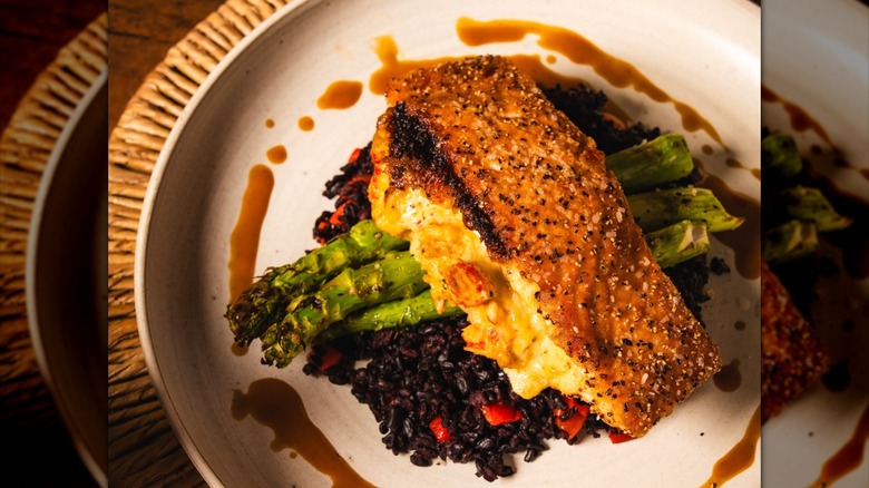 Stuffed salmon on a bed of asparagus
