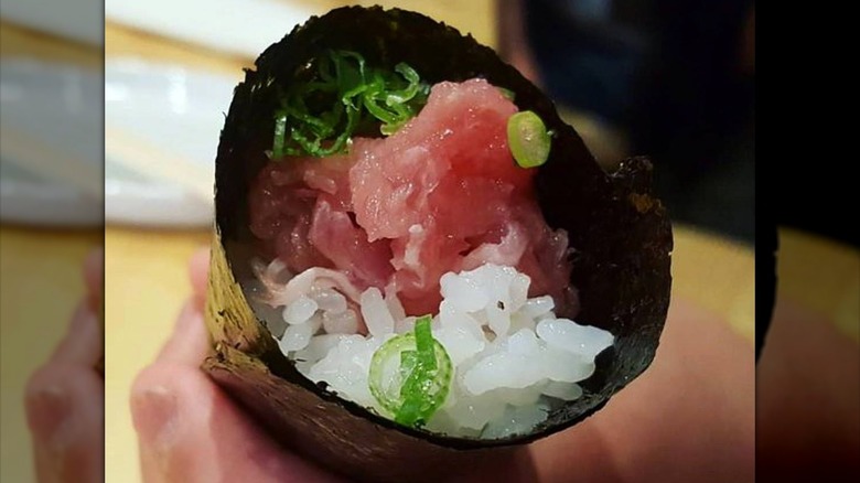 Handroll with raw fish and rice
