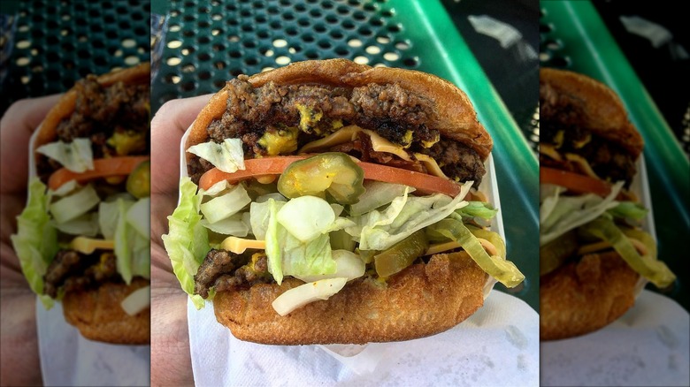 Close-up of a double cheeseburger with all the fixings