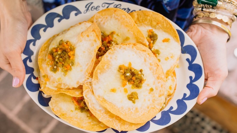 Nachos and enchiladas with cheese and toppings