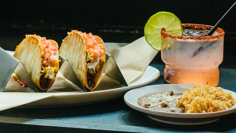 Tacos with a side of rice and beans