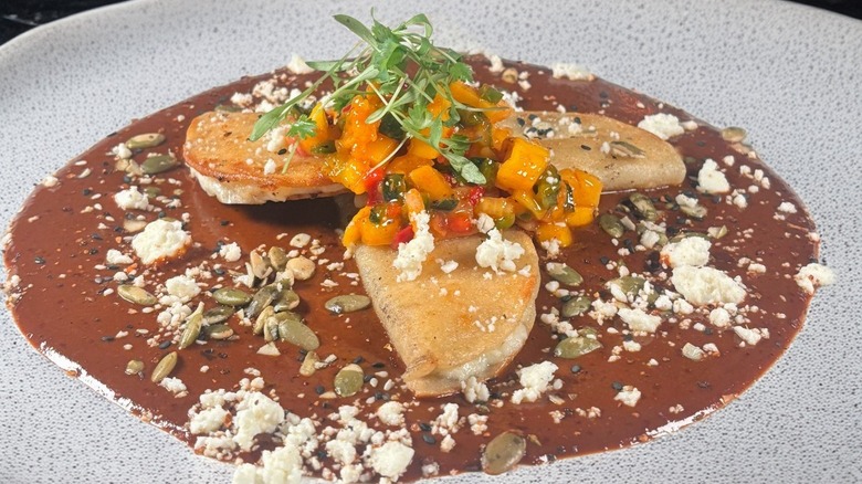 Street tacos in a molé sauce