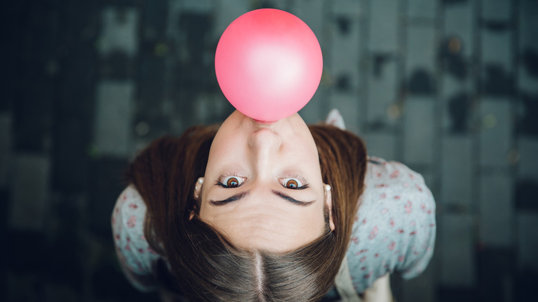 Woman blowing bubblegum