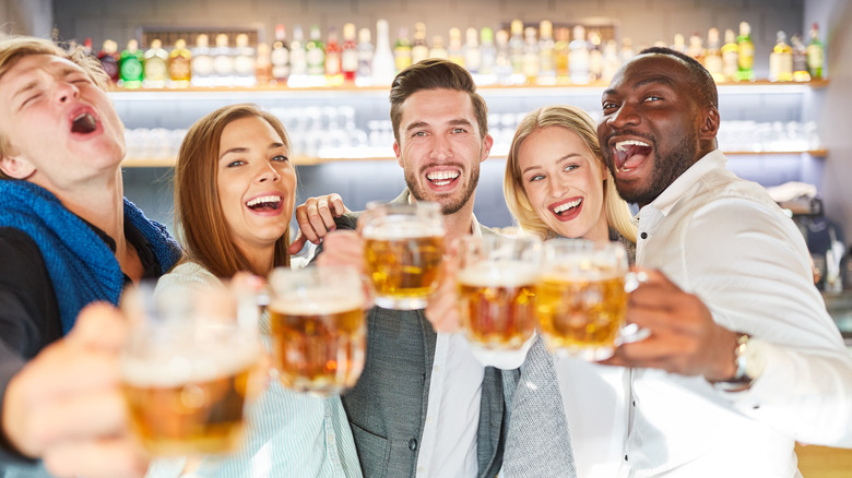 Friends toasting beers