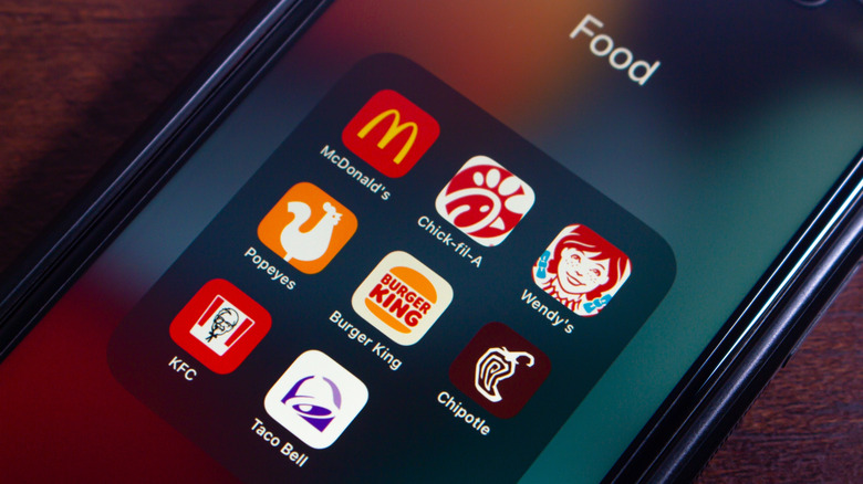 The Chick-fil-A app grouped with other fast food apps on a smartphone