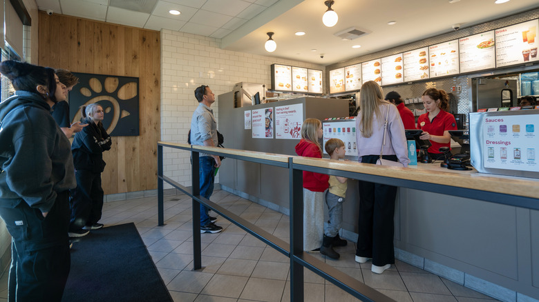 A family ordering Chick-fil-A at the register