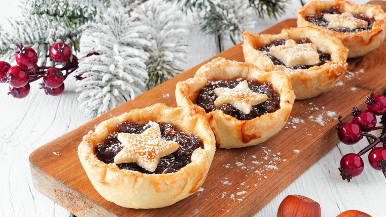 Mince pies with star pastry tops and festive decoration