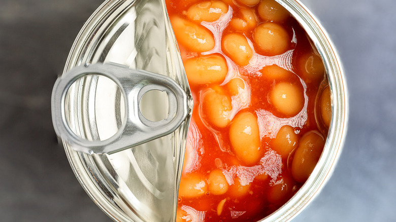 can of baked beans with lid open POV opening