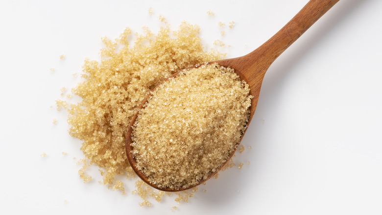 Wooden spoon with brown sugar