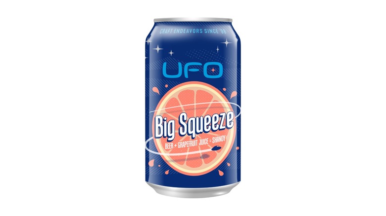 Blue can of UFO Big Squeeze on a white background