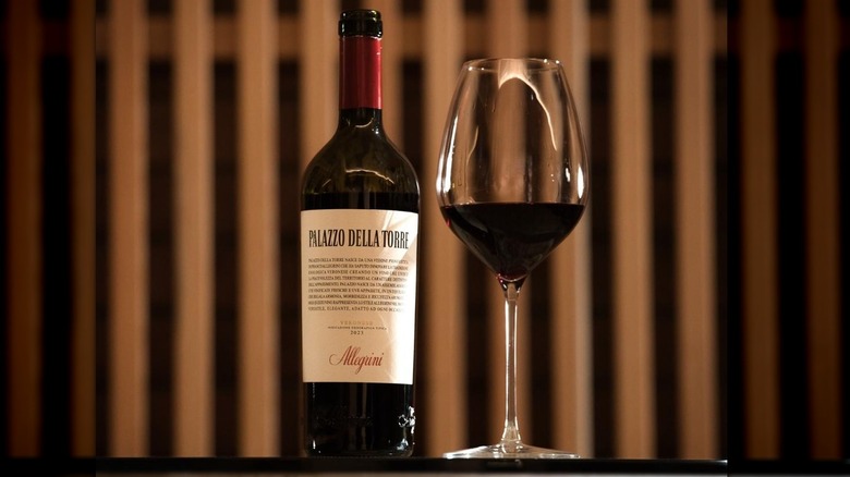 Bottle and glass of Allegrini Palazzo della Torre red wine