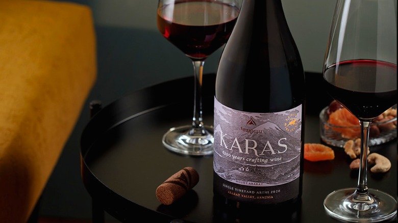Bottle and two wine glasses of Karas Single Vineyard Areni red wine