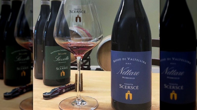 Bottle and glass of Tenuta Scerscé Nattare Nebbiolo Rosso di Valtellina D.O.C.