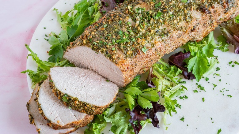 sliced pork tenderloin on plate
