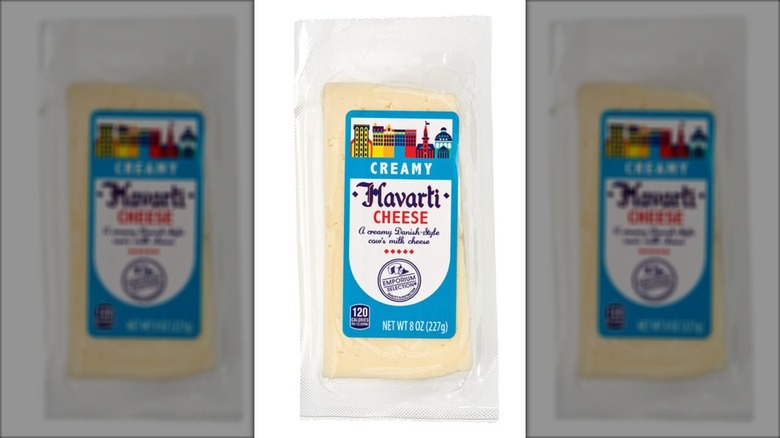Package of Havarti cheese against white background.