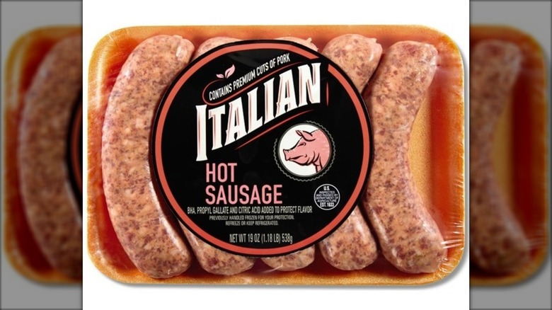 Package of hot Italian sausage links against white background.