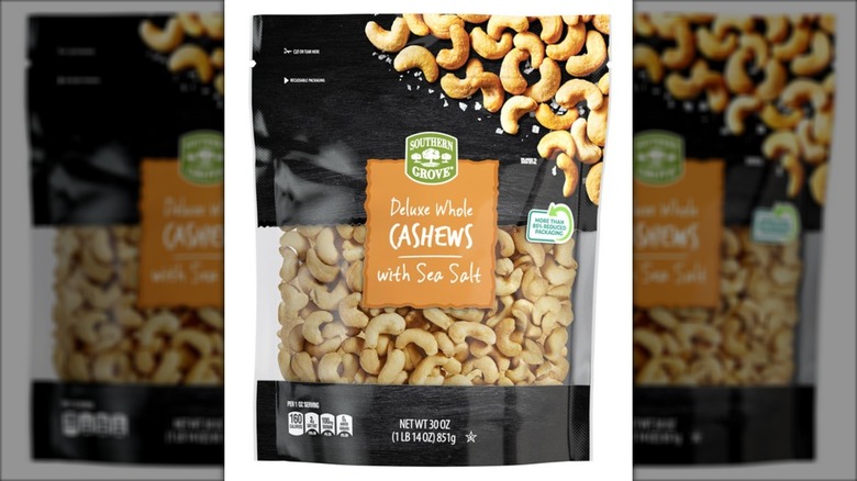 Bag of sea salt-flavored cashews against white background.