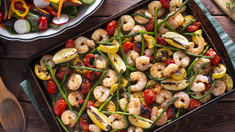 A sheet pan meal with shrimp, asparagus, and other veggies