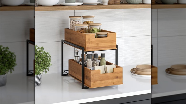 The Seville 2-tier bamboo organizer with jars of herbs and grains