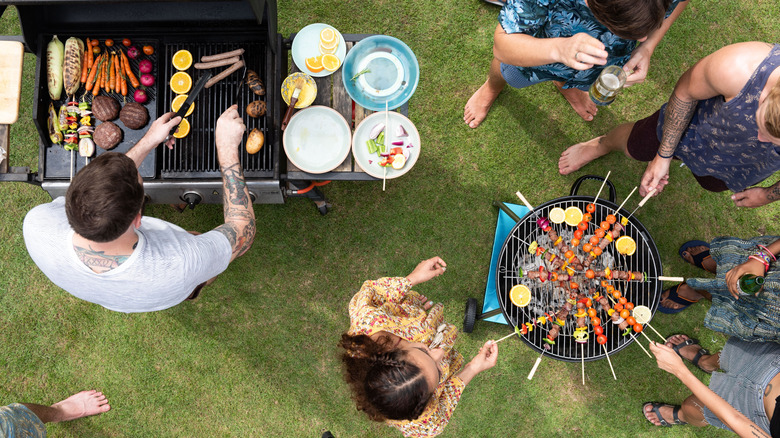Aerial view of friends grilling and drinking together